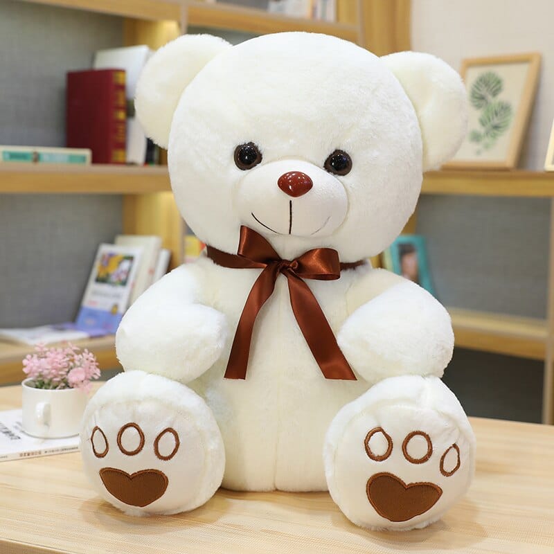 Ours en peluche coloré avec un petit nœud