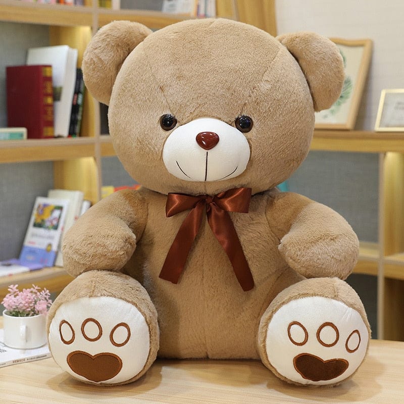Ours en peluche coloré avec un petit nœud
