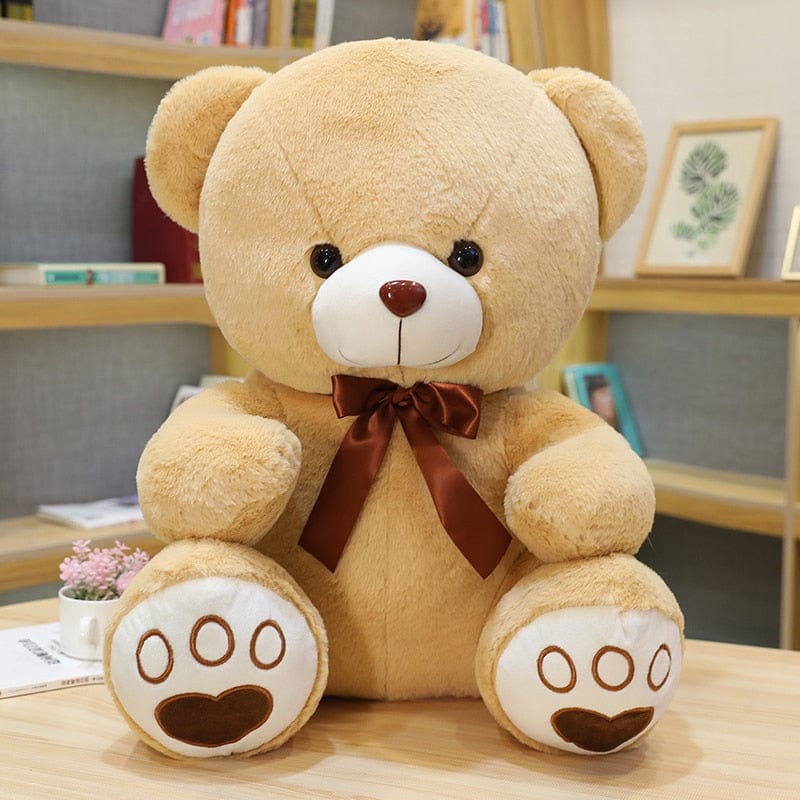 Ours en peluche coloré avec un petit nœud
