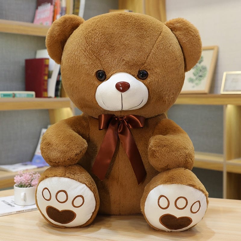 Ours en peluche coloré avec un petit nœud