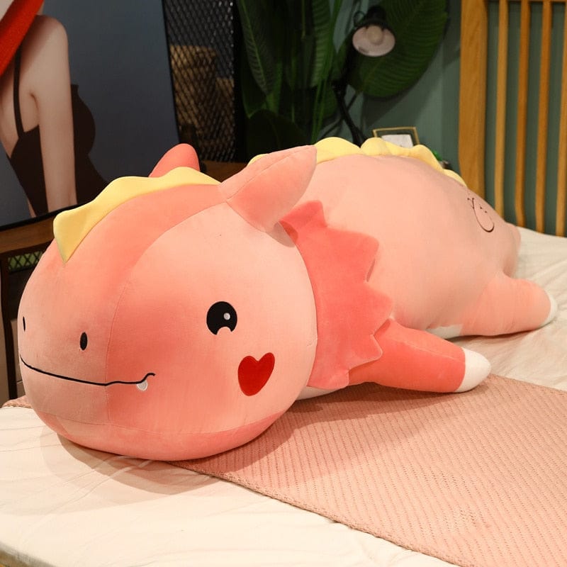 Peluche dinosaure avec un cœur sur la joue