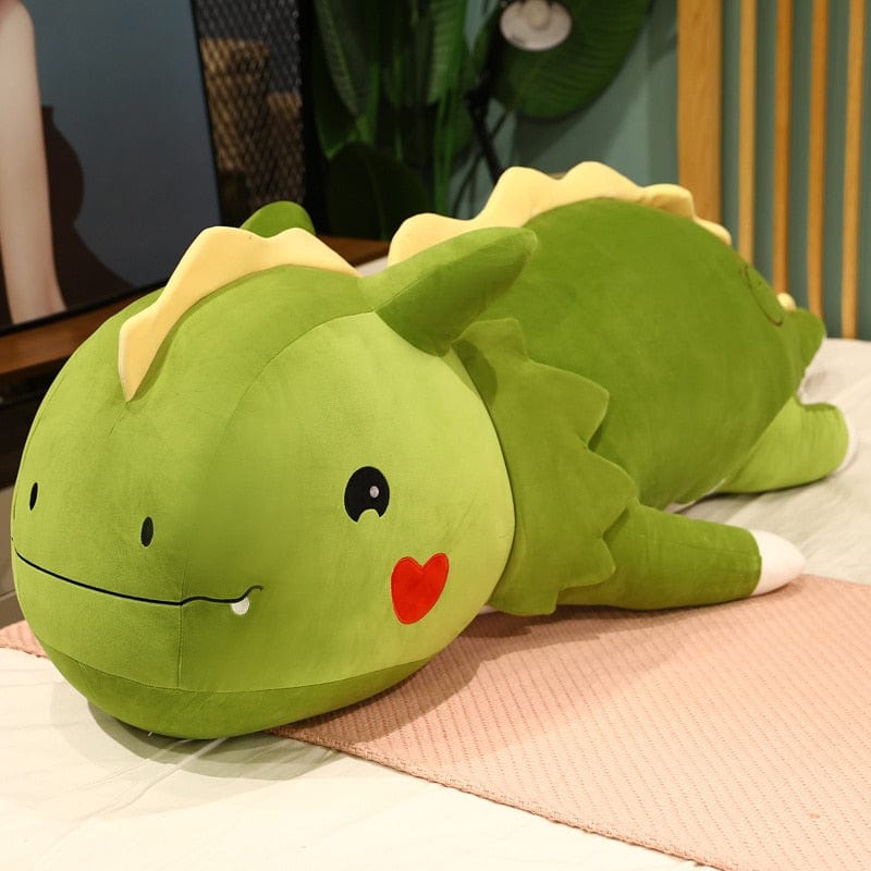 Peluche dinosaure avec un cœur sur la joue