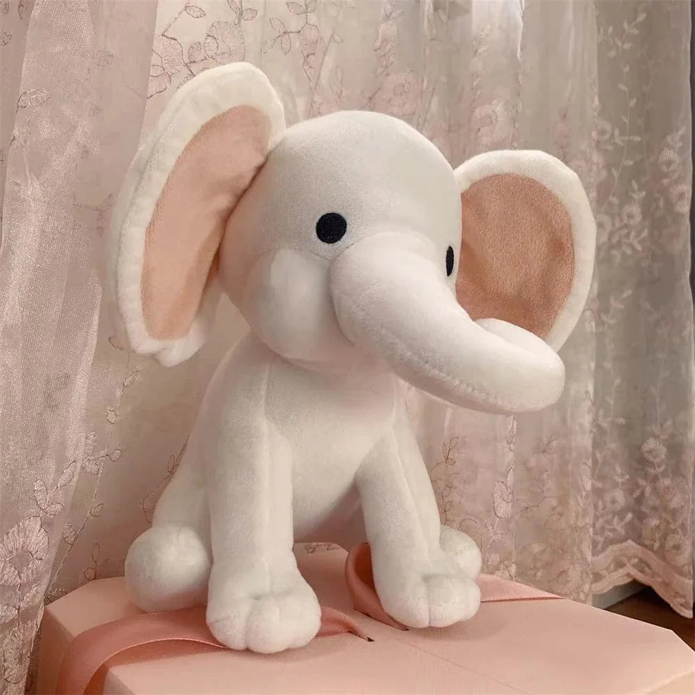 Peluche éléphant coloré avec sa trompe tordue