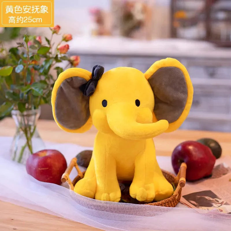 Peluche éléphant coloré avec sa trompe tordue