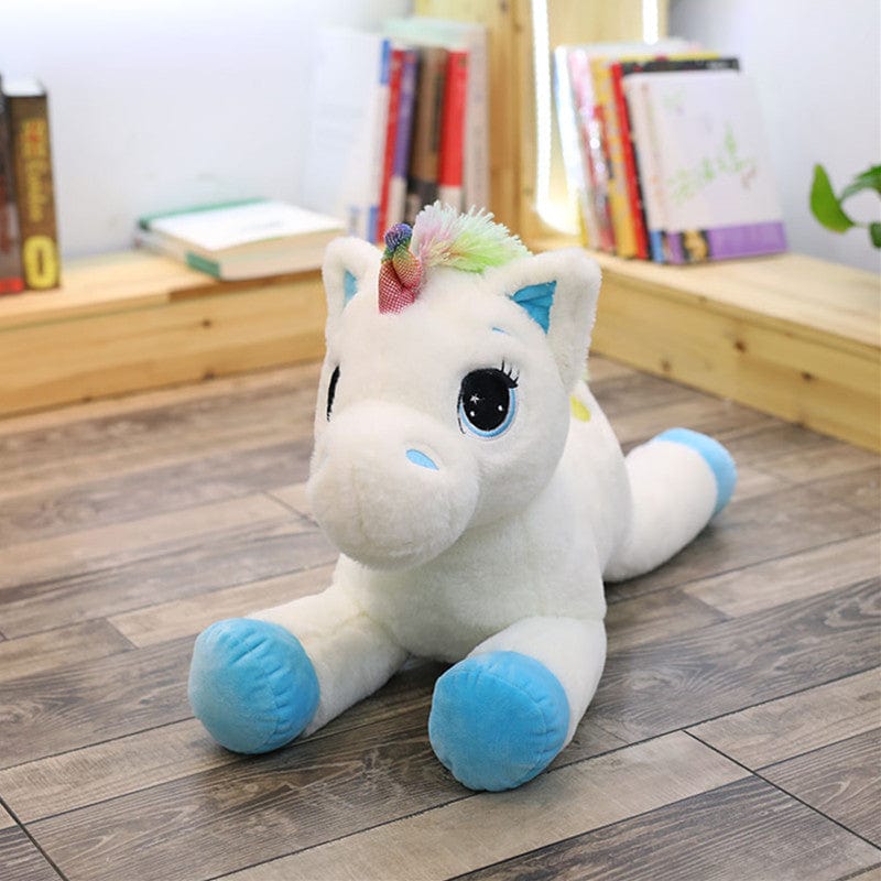 Peluche licorne avec des étoiles dans les yeux