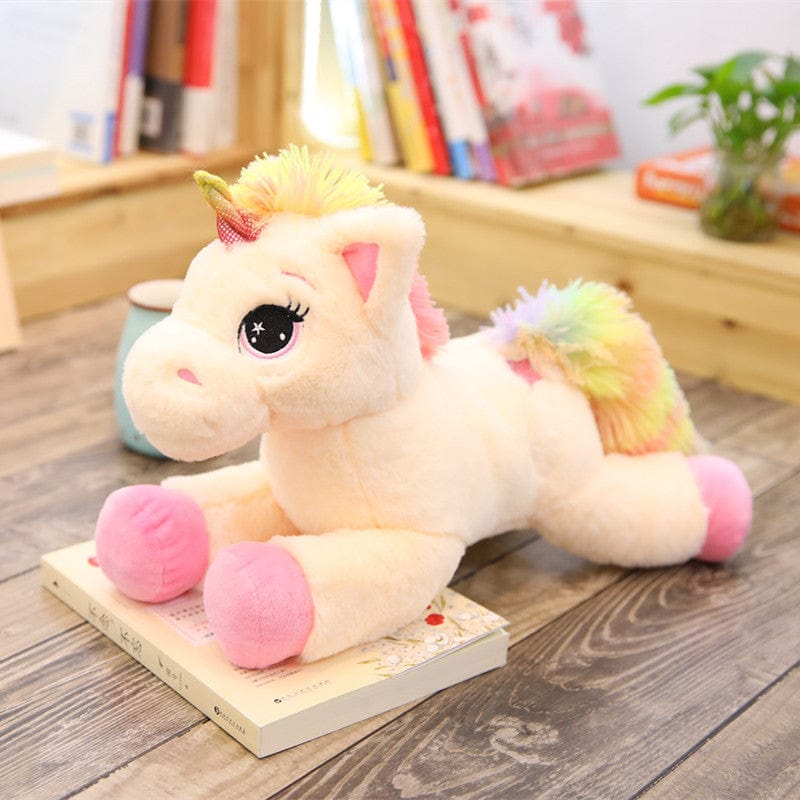 Peluche licorne avec des étoiles dans les yeux