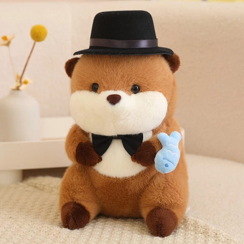 Peluche loutre avec un chapeau qui tient un poisson coloré