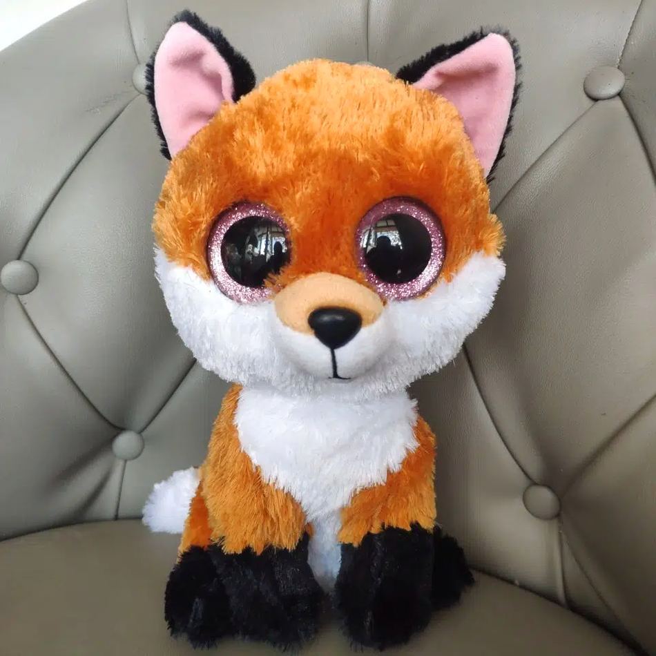 Peluche renard doux aux yeux noirs charmeurs forêt