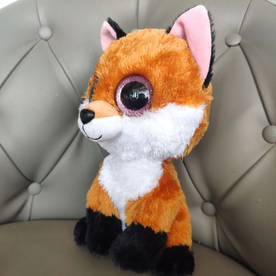 Peluche renard doux aux yeux noirs charmeurs forêt