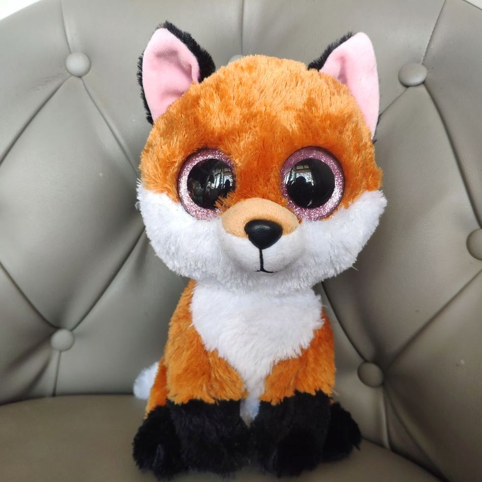 Peluche renard doux aux yeux noirs charmeurs forêt