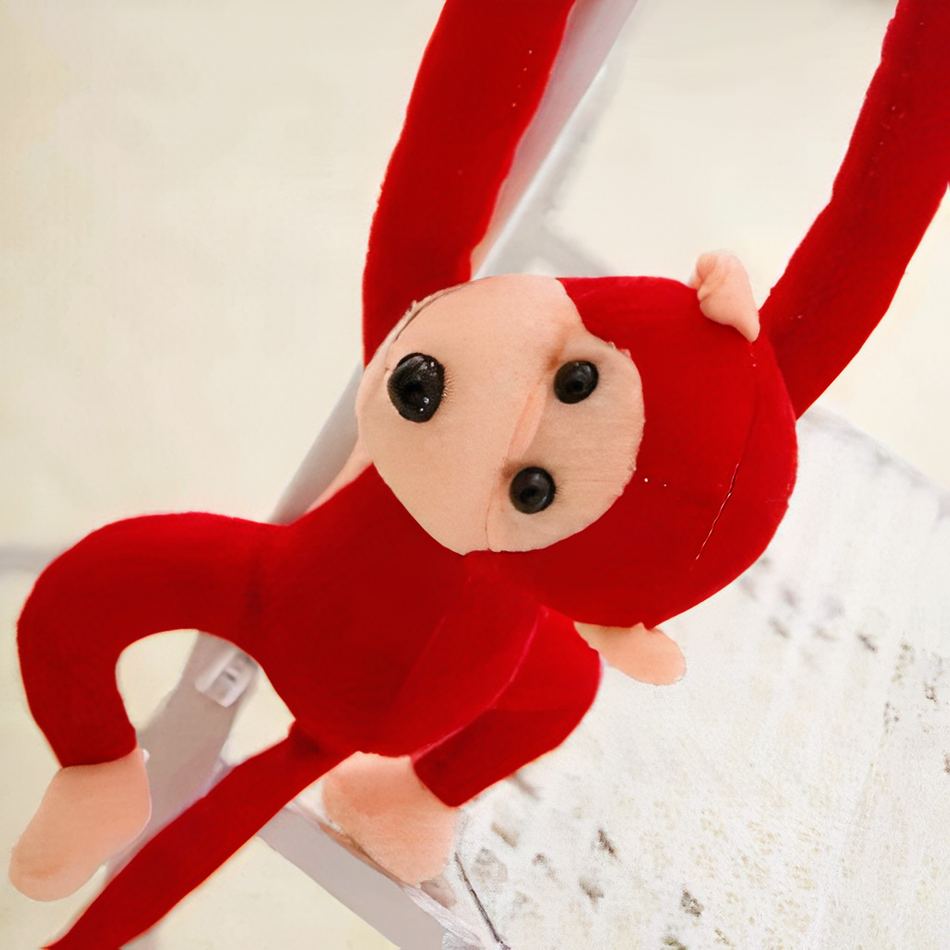 Peluche singe kawaii douce avec longue queue rouge