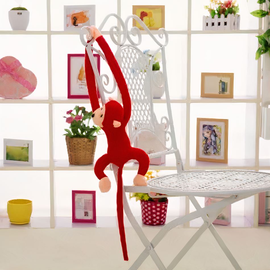 Peluche singe kawaii douce avec longue queue rouge
