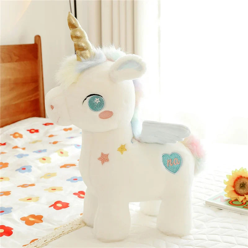 Peluche licorne blanche étoilée avec ailes et corne dorée