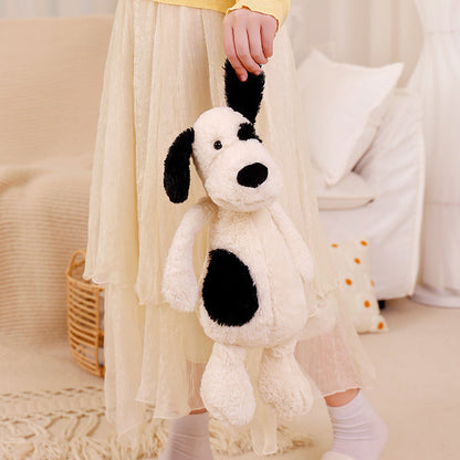 Peluche chien blanc avec un œil noir
