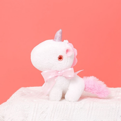 Peluche licorne miniature douce avec nœud et cornet pailleté