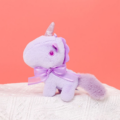 Peluche licorne miniature douce avec nœud et cornet pailleté