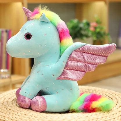 Peluche licorne bleu à crinière arc-en-ciel magique