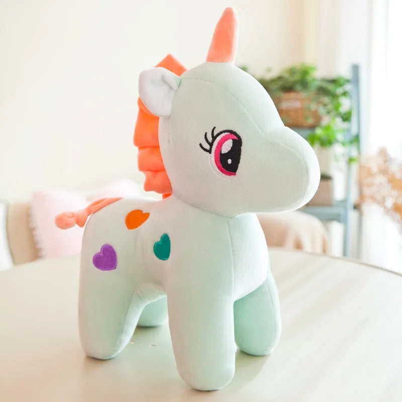 Peluche licorne multicolore avec des cœurs