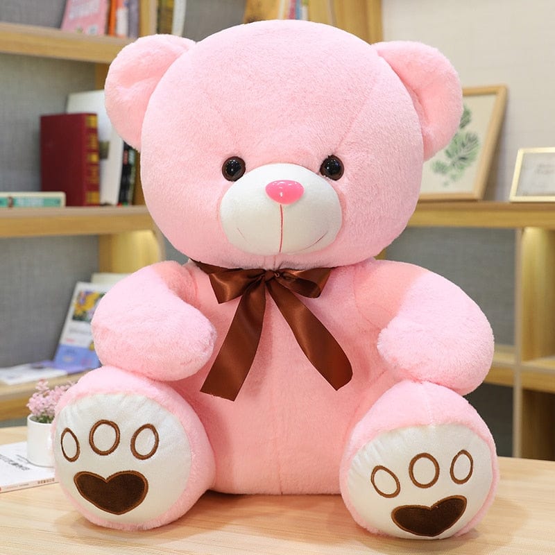 Ours en peluche coloré avec un petit nœud
