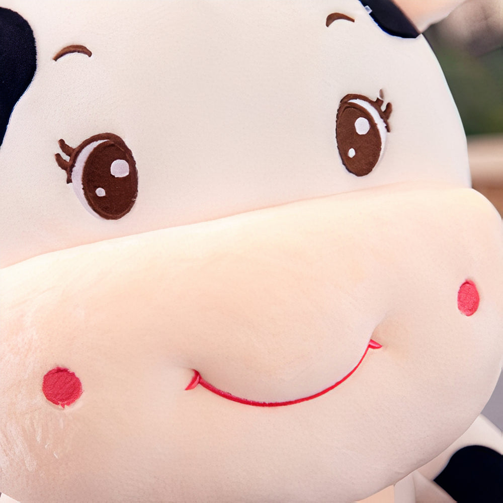 Peluche vache bébé souriant