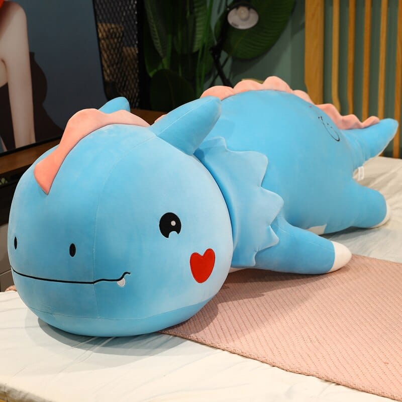 Peluche dinosaure avec un cœur sur la joue