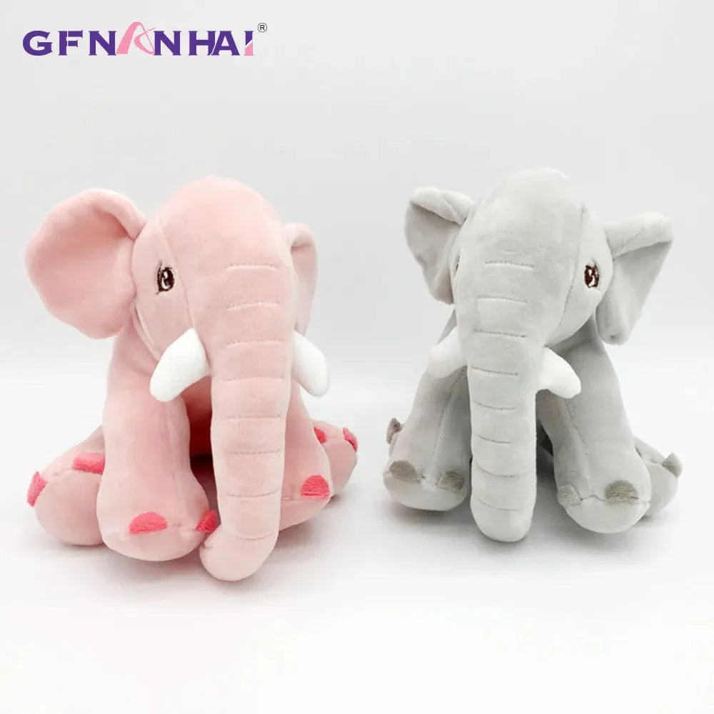 Peluche éléphant assis et content