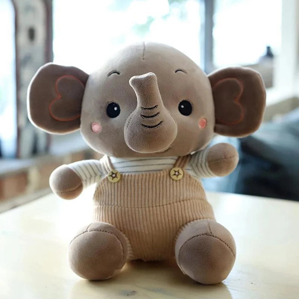 Peluche éléphant content en petite salopette