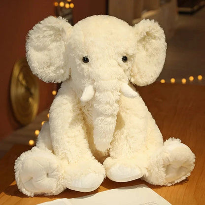Peluche éléphant poilu aux petites défenses
