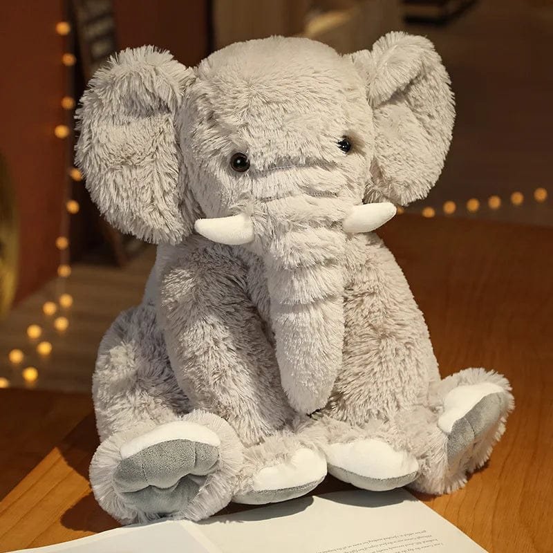 Peluche éléphant poilu aux petites défenses