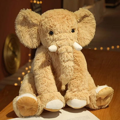 Peluche éléphant poilu aux petites défenses