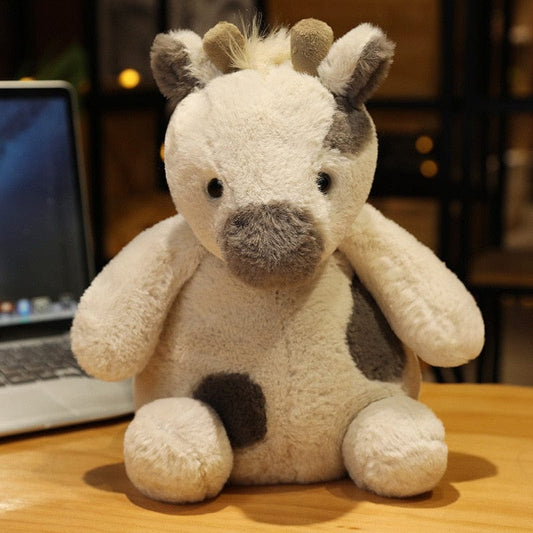 Peluche girafe bébé blanc aux tâches grises