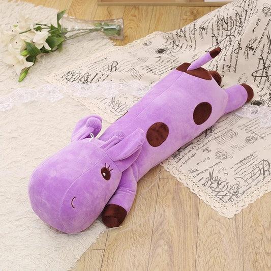 Peluche girafe géante allongée violette