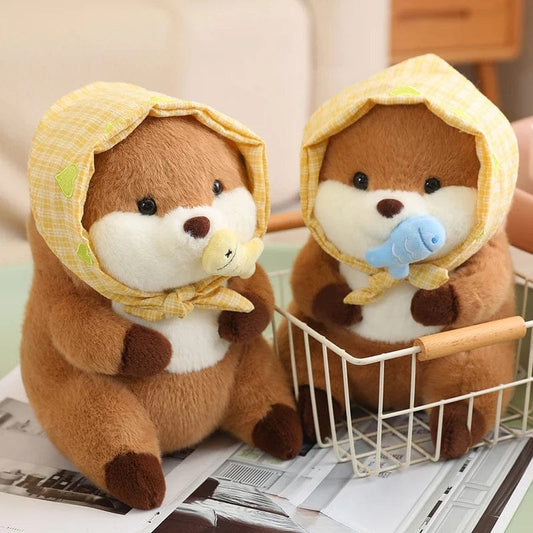 Peluche loutre avec un voile qui tient un poisson coloré
