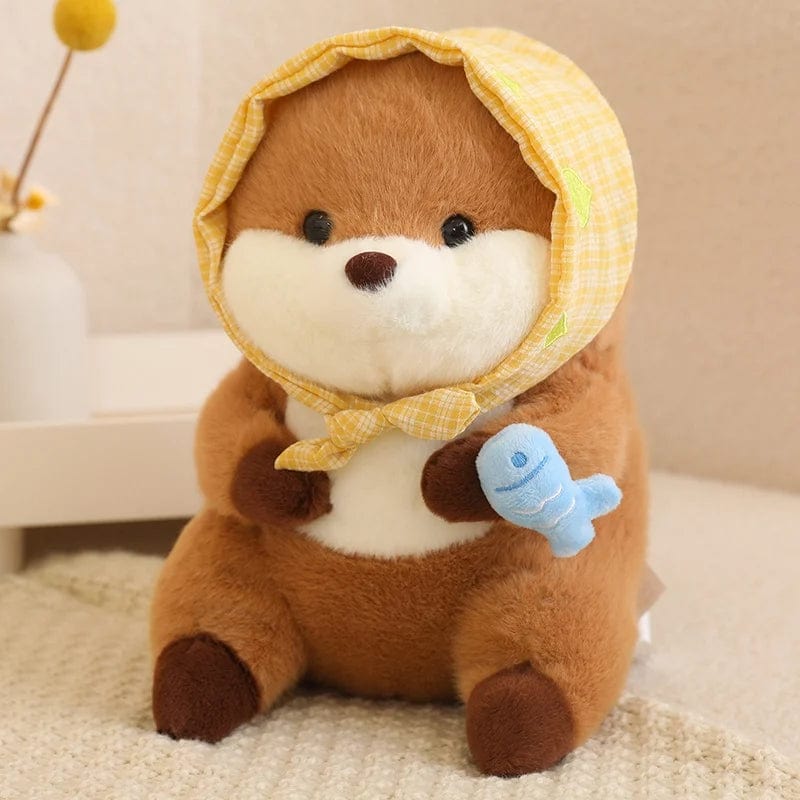 Peluche loutre avec un voile qui tient un poisson coloré