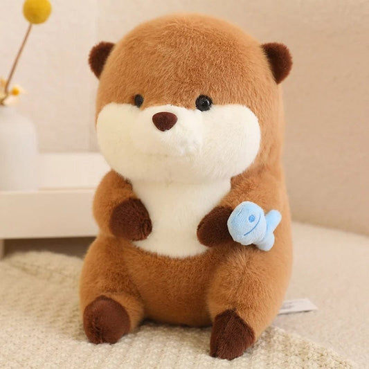Peluche loutre qui tient un poisson coloré