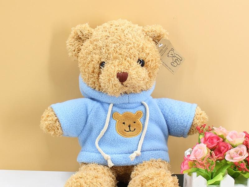 Peluche ourson doux pull bleu câlin hiver enfant