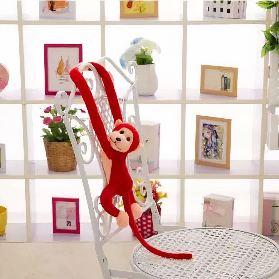 Peluche singe kawaii douce avec longue queue rouge