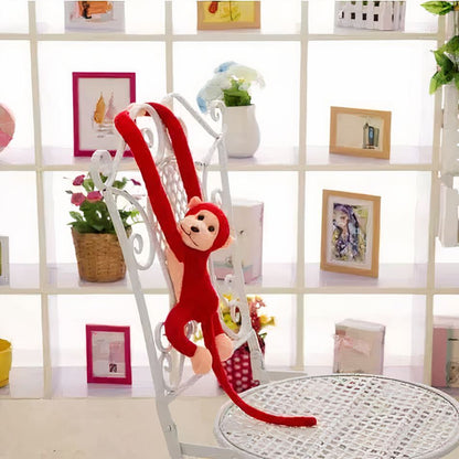 Peluche singe kawaii douce avec longue queue rouge