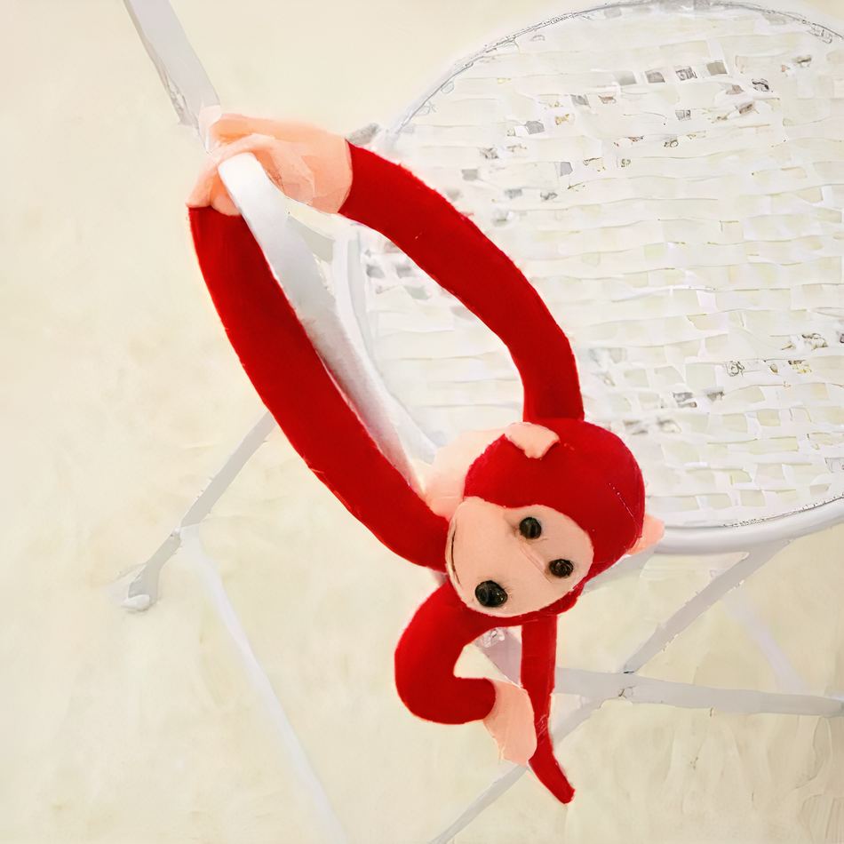 Peluche singe kawaii douce avec longue queue rouge