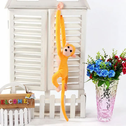 Peluche singe kawaii jaune moelleux longue queue enfant
