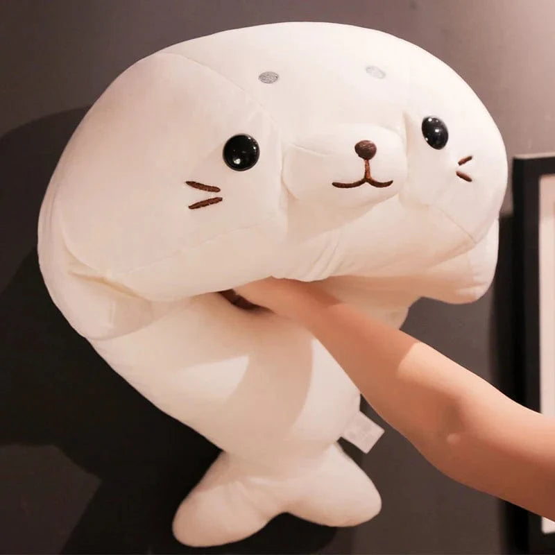 Peluche Squishmallow phoque blanc content