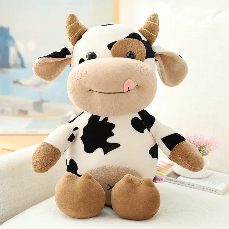 Peluche vache toute douce qui tire la langue